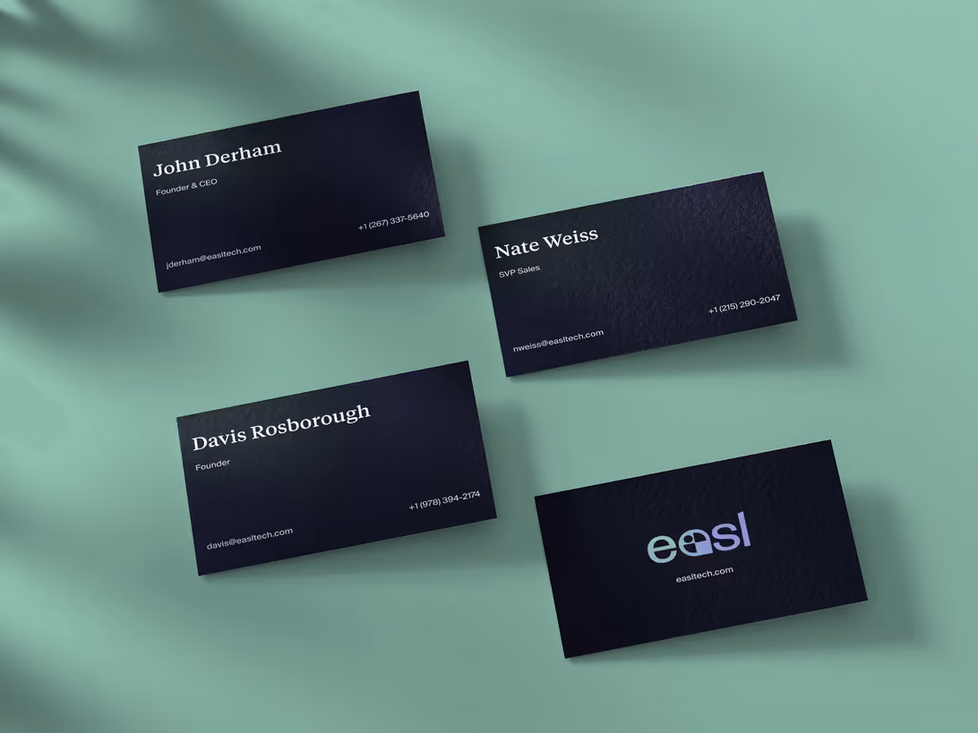 EASL TECH business cards in dark navy with the EASL wordmark on a mint background